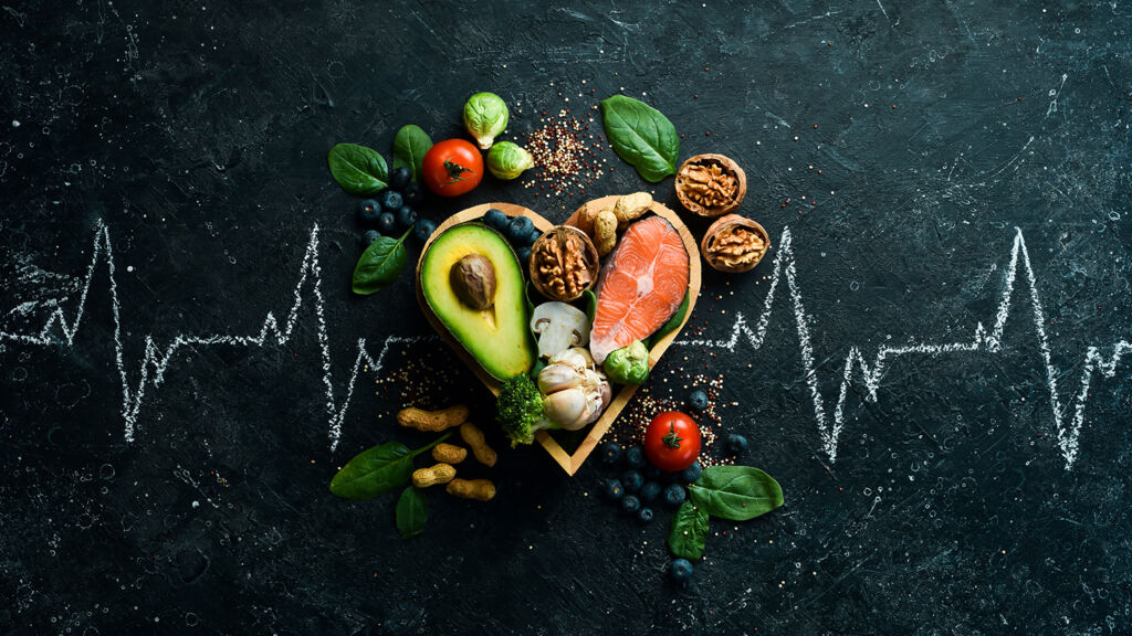 food-banner-healthy-foods-low-carbohydrates-food-heart-health-salmon-avocados-blueberries-broccoli-nuts-mushrooms-black-stone-background-top-view-1024x576.jpg
